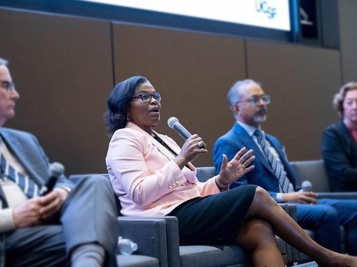 UCSF leadership panel featuring Sam Hawgood, UCSF Chancellor (left), Renee Navarro, Vice Chancellor, Opportunity and Outreach (speaking), Suresh Gunasekaran, President and Chief Executive Officer of UCSF Health, and Elizabeth Ozer, professor of Pediatric and Adolescent Medicine, participate in a Q&A, at the 2025 Chancellor Leadership Forum on Diversity and Inclusion, at the Pritzker Auditorium.