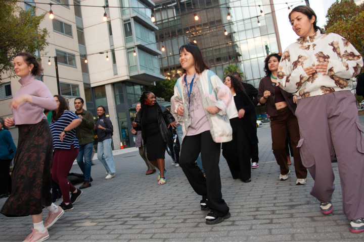 Several UCSF community members participate in salsa dance lessons during Bailamos 2026